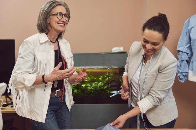 cheerful fashion designers fashion design tailoring atelier seamstresses tailors sewers dressmakers with sewing items clothing design workshop 328764 9930